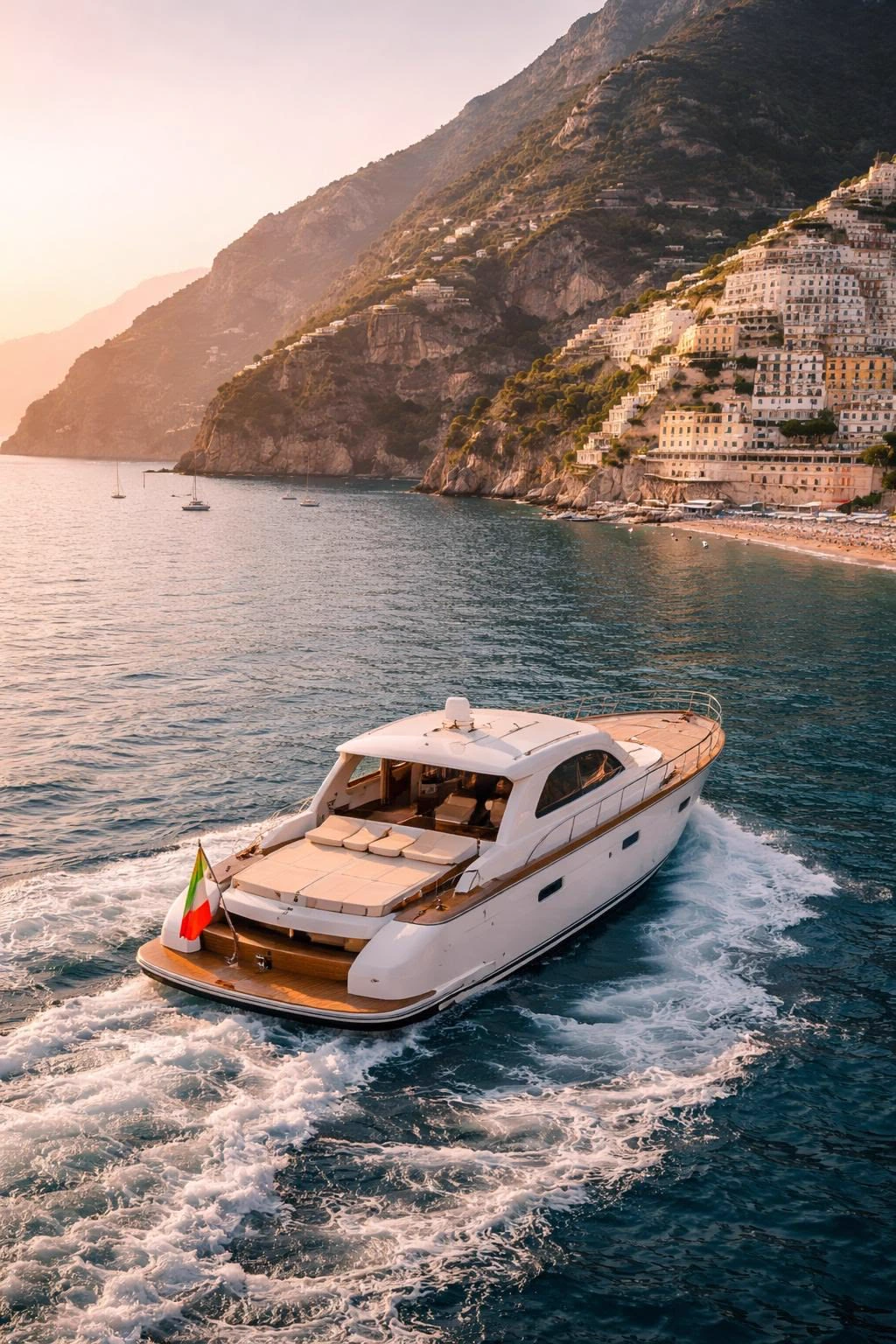 Motor yacht beside a coastal village